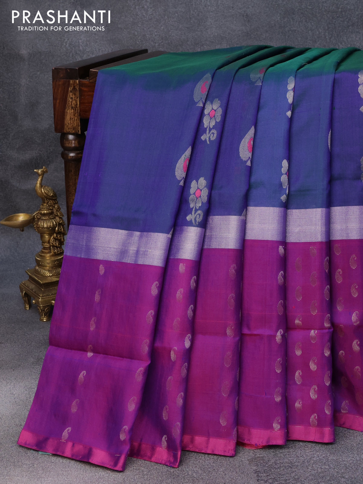 Pure uppada silk saree dual shade of bluish green and purple with thread & silver zari woven buttas and long silver zari woven paisley butta border