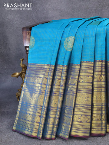 Pure kanjivaram silk saree cs blue and dual shade of maroon with allover zari checks & buttas and long zari woven border