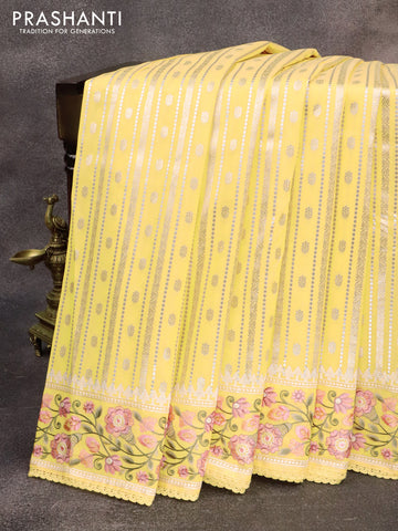 Banarasi cotton saree pale yelloew with allover silver & gold zari weaves and floral embroidery border