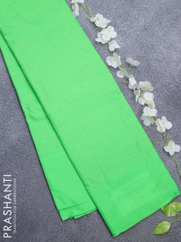 Arani semi silk saree green with allover copper zari checked pattern and simple border