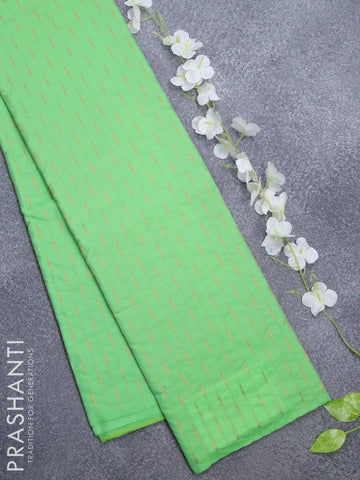 Arani semi silk saree green with allover copper zari weaves in borderless style