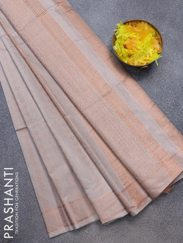 Bamboo silk saree grey shade with allover copper zari woven butta weaves and zari woven border