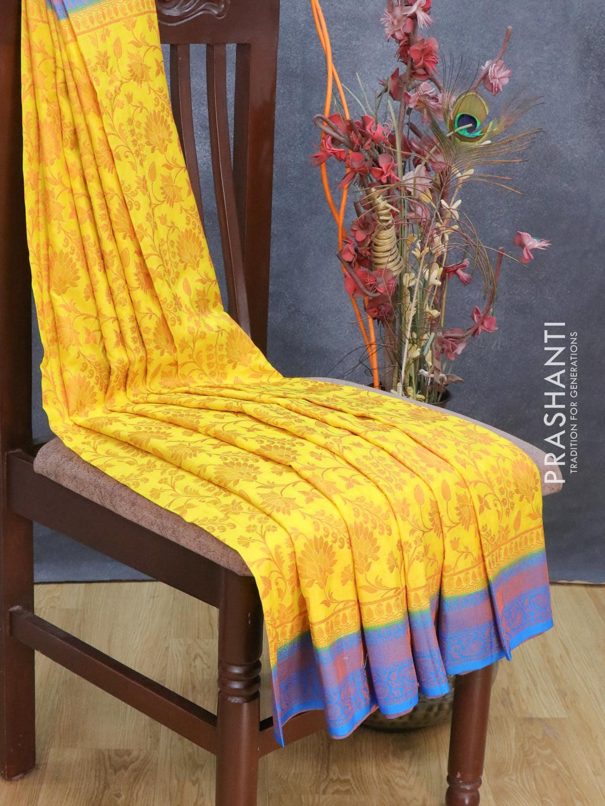 Banarasi semi crepe saree yellow and cs blue with allover copper zari weaves and copper zari woven border