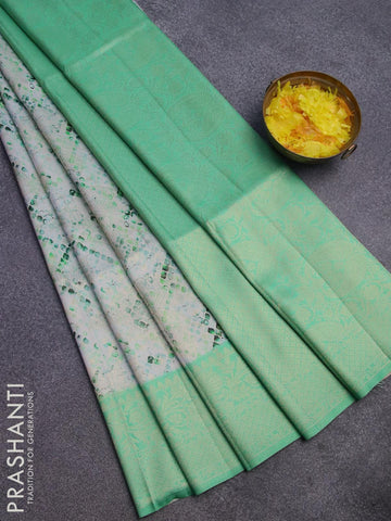 Banarasi softy silk saree off white and teal green with allover zari weaves & geometric digital prints and zari woven border