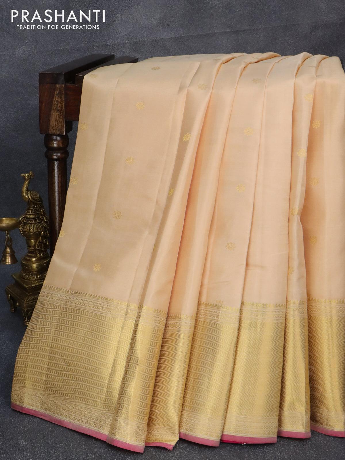 Pure kanjivaram silk saree sandal and pink with allover floral zari woven buttas and long zari woven border